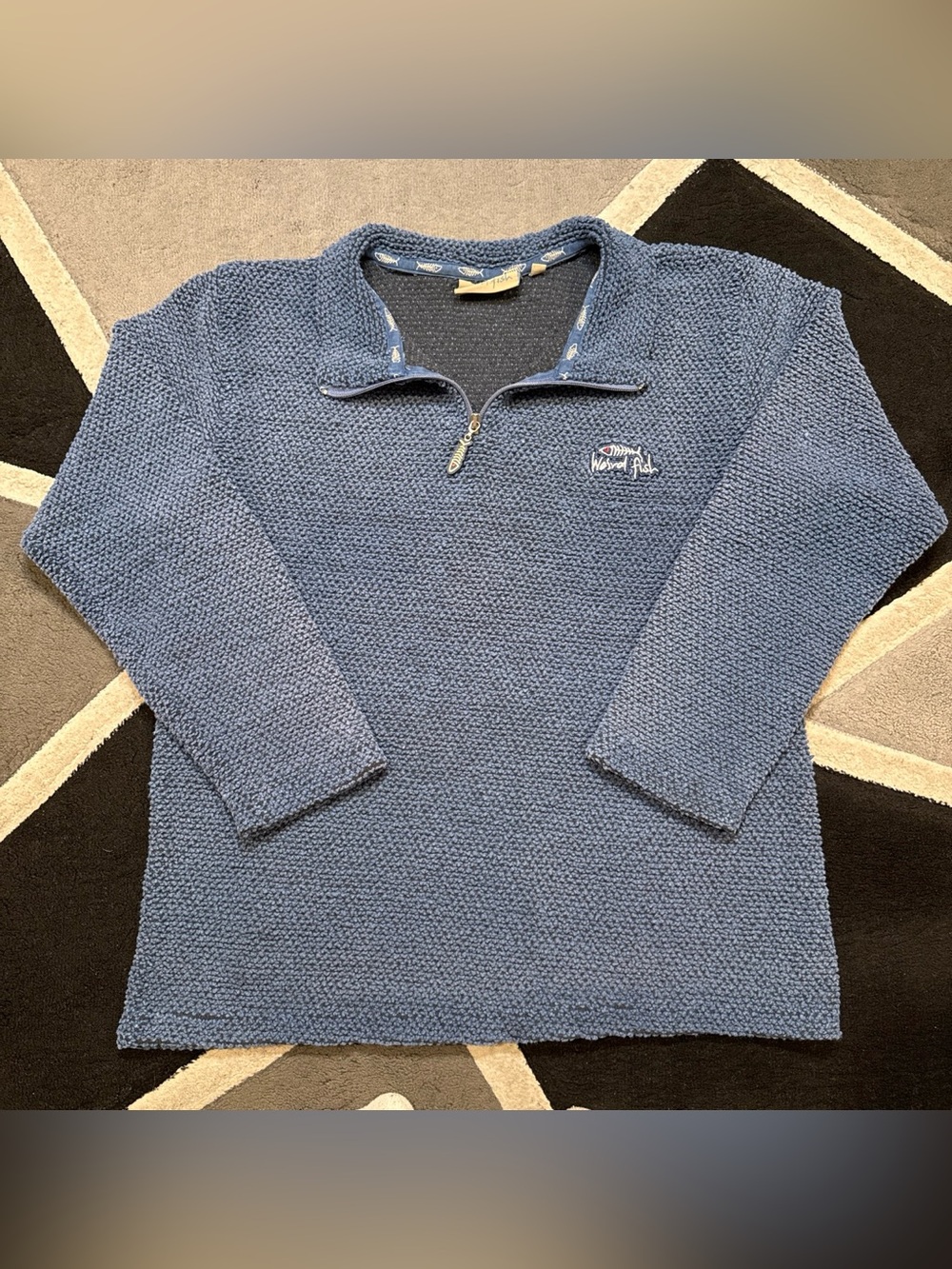 Blue women’s Weird Fish quarter zip sweatshirt with proprietary textured knit